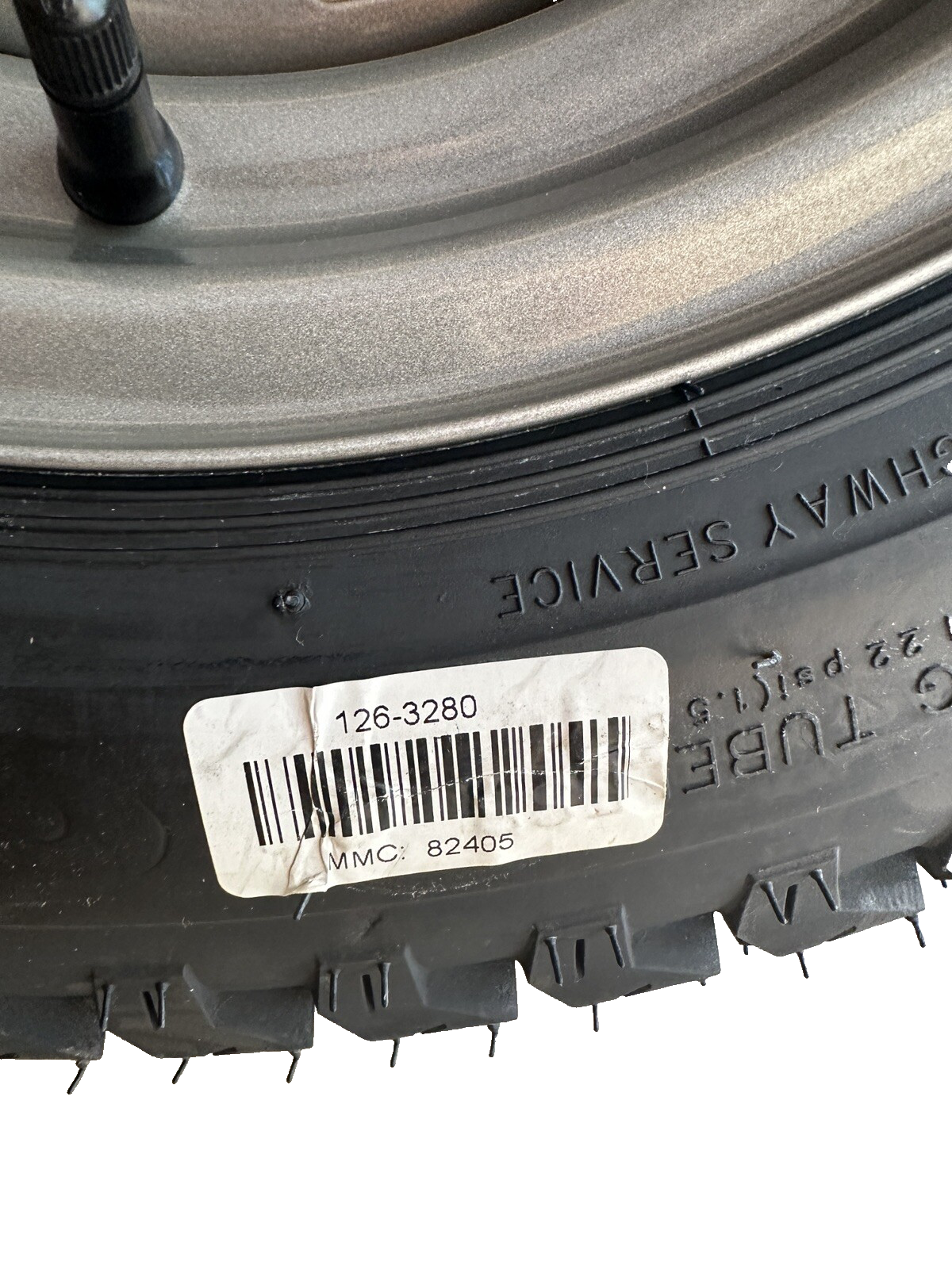 TORO LAWNBOY 126-3280 WHEEL AND TIRE ASSEMBLY 22 x 9.50 - 12 NHS 4 LUG