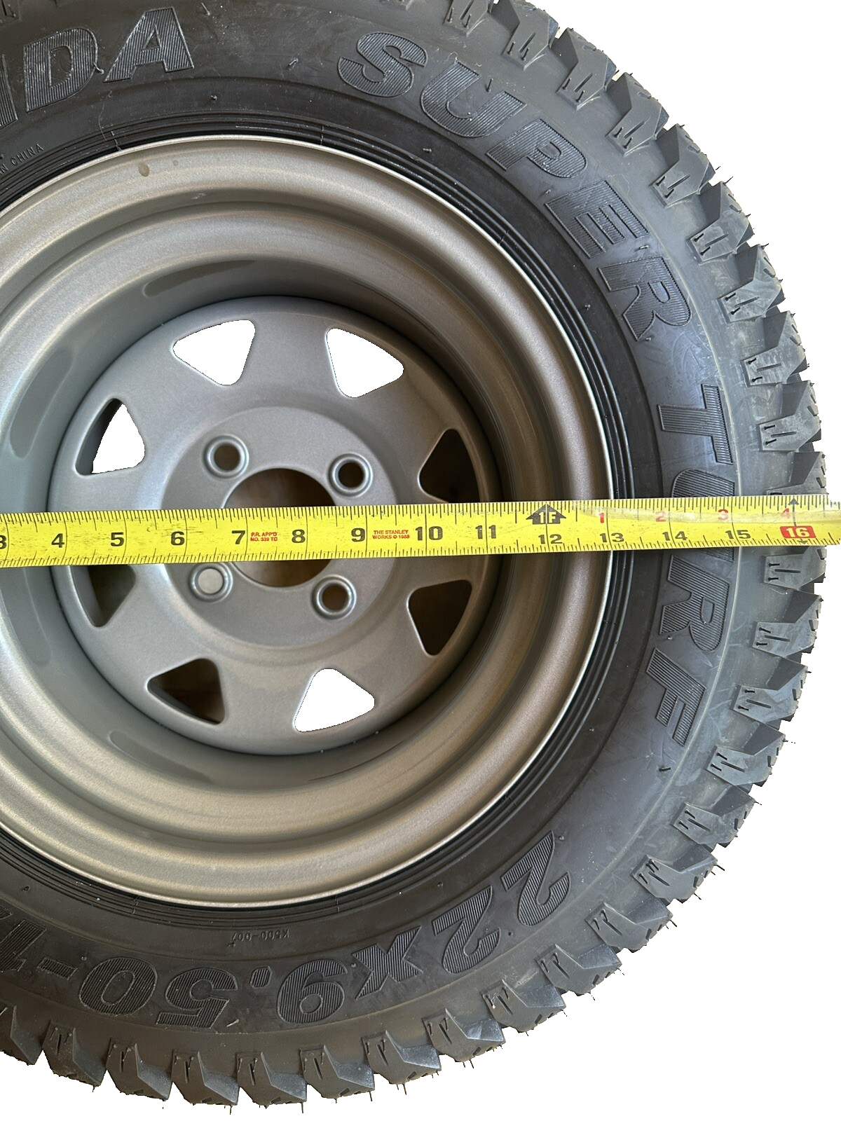 TORO LAWNBOY 126-3280 WHEEL AND TIRE ASSEMBLY 22 x 9.50 - 12 NHS 4 LUG